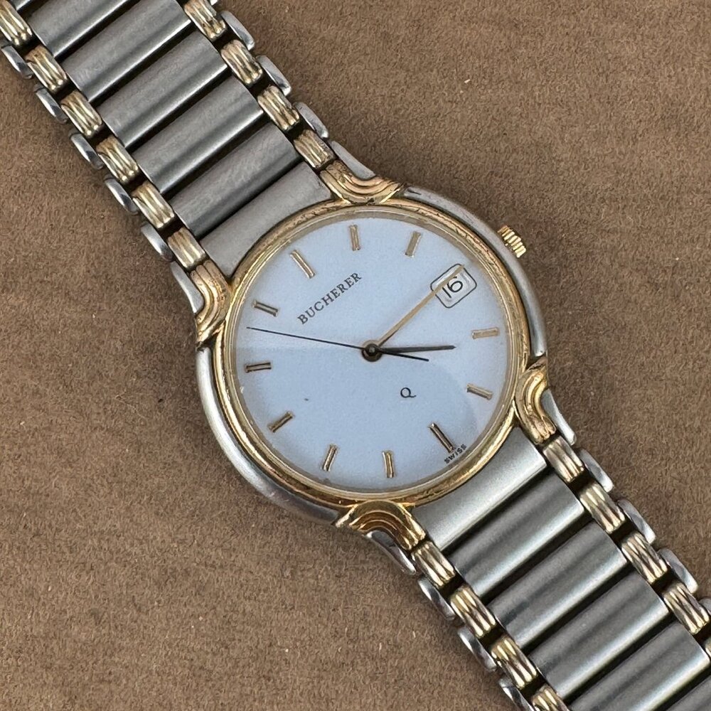 Vintage Bucherer Q quartz wristwatch, model Q 255.604, is a men's timepiece